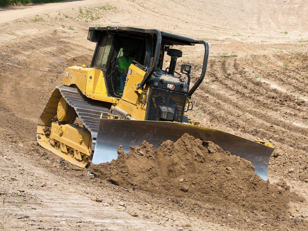 How do the functions of hydraulic systems differ across various types of construction machinery? ttj